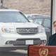 António Guterres at a podium in front of aHonda.